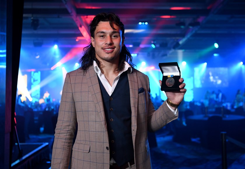 Tino Fa'asuamaleaui with the Paul Broughton Medal in 2022. Photo: Titans Media