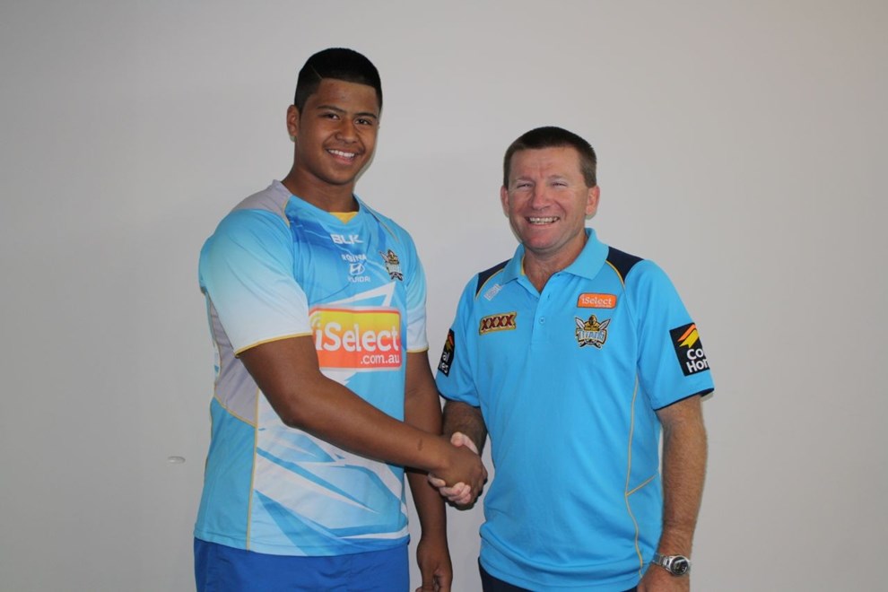 Payne Haas is congratulated by Jamie McCormack after signing with the Titans.