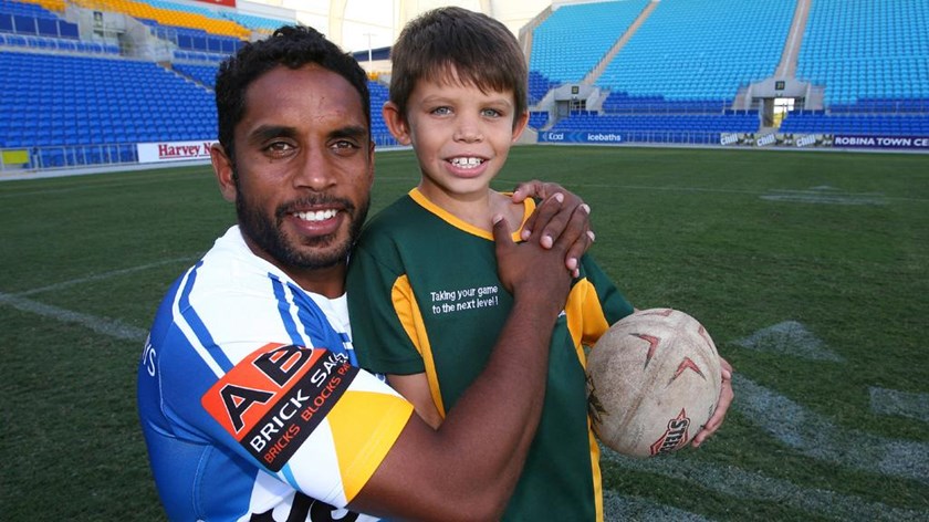 Jayden Campbell with his father, Preston, who was the Titans' inaugural signing.
